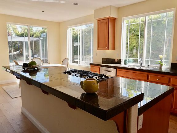 Enormous gourmet kitchen island with butler pantry