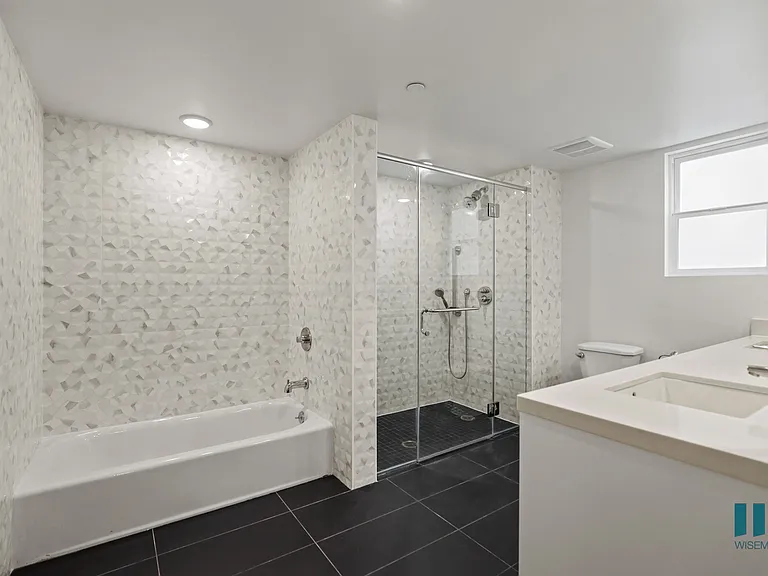 Large-Size Bathroom with Bathtub, Walk-In Shower, and Double-Sink Vanity with Cabinet Storage