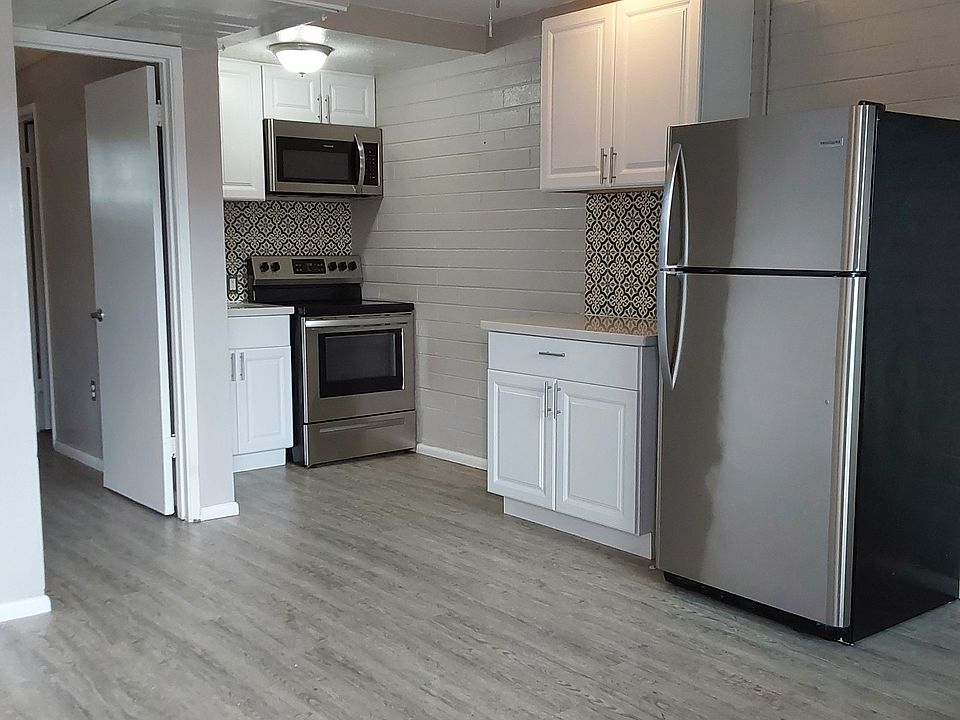 Kitchen - Stainless Steel Appliances, Grey Color Scheme.