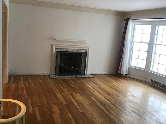 Living room with wood burning fireplace