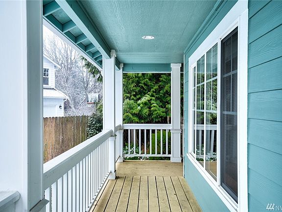 Welcoming covered wrap around porch shelters and greets you after a long day. Stay and relax awhile as you wave to passerby's.