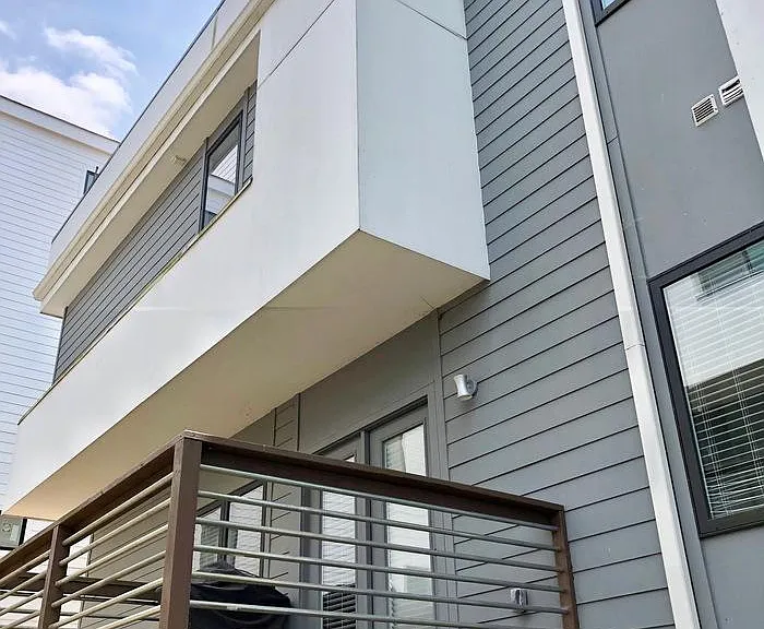 Back of house with outdoor deck