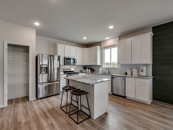 Island kitchen with recessed lighting
