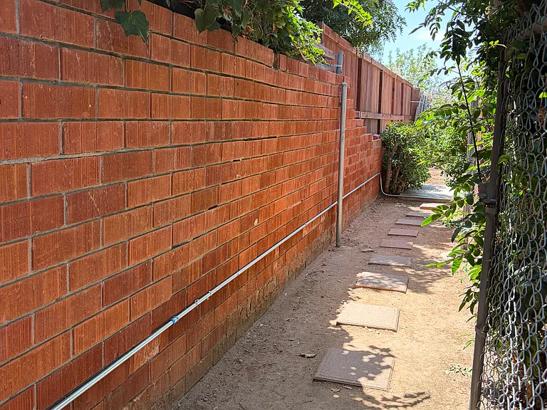 walkway to large backyard area