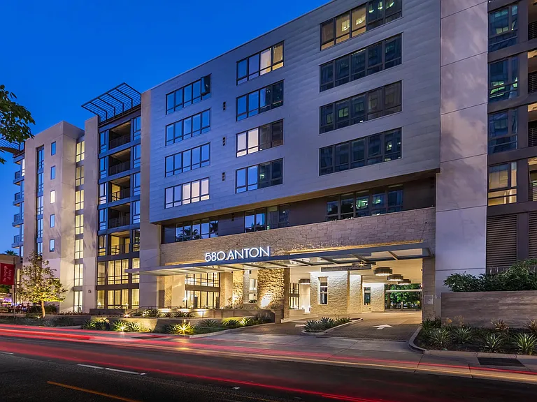 Evening exterior with illuminated entry for a welcoming arrival.