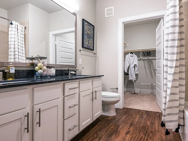 Bathrooms are complete with polished chrome hardware and fixtures.