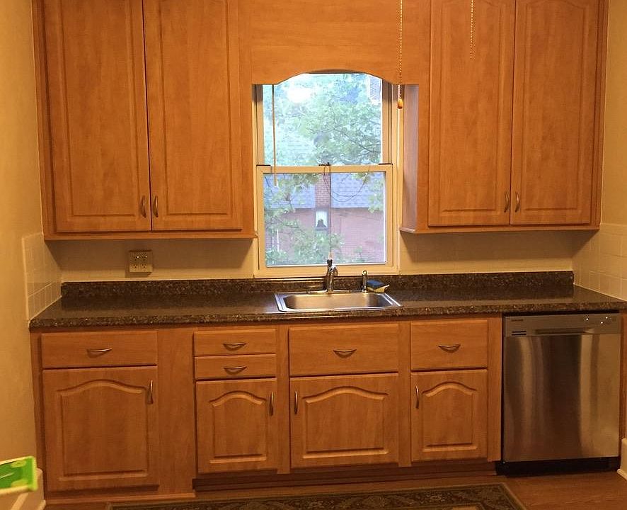 Kitchen with new counter top, sink and dishwasher