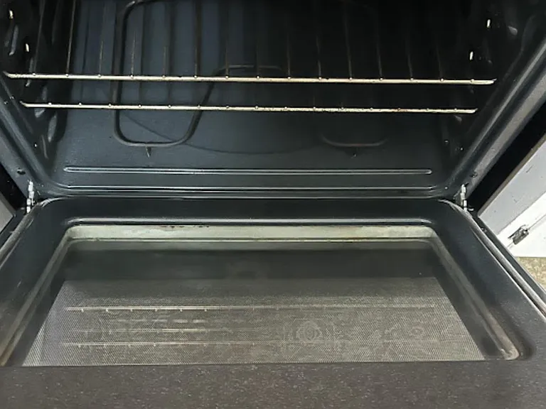 Kitchen oven with interior racks for baking and roasting.