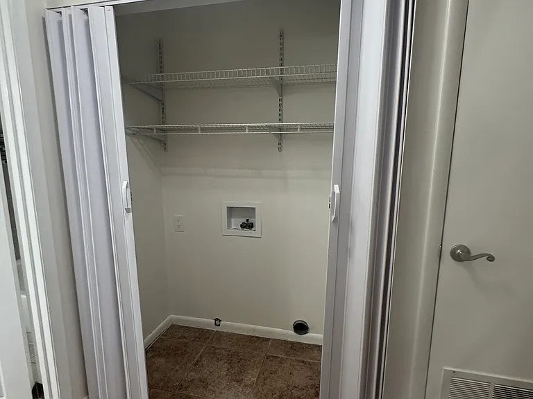 Laundry closet open.