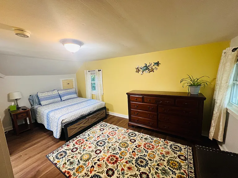 Second floor bedroom with large closet, dressers, Full size bed, A/C, and TV