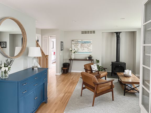 Living area with wood burning fireplace.