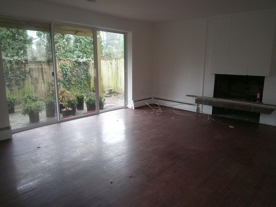 spacious LR, wood-burning FP, private walled garden