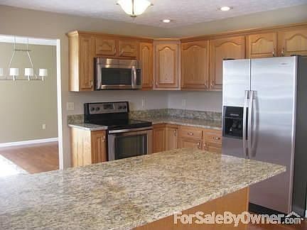 Kitchen
						:
						Granite countertops and new Whirlpool stainless steel appliances