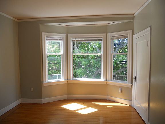 Living room, window and closet door.