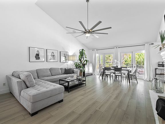Family room with wood burning fireplace. French doors leading out to the pool.