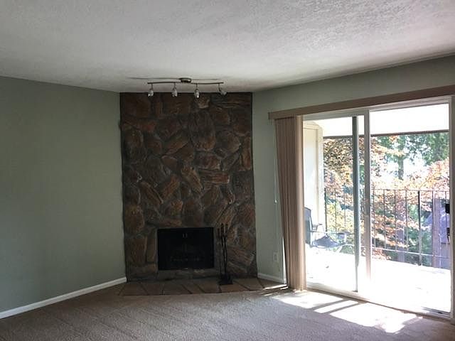 livingroom w/ fireplace, lanai w/ closet storage