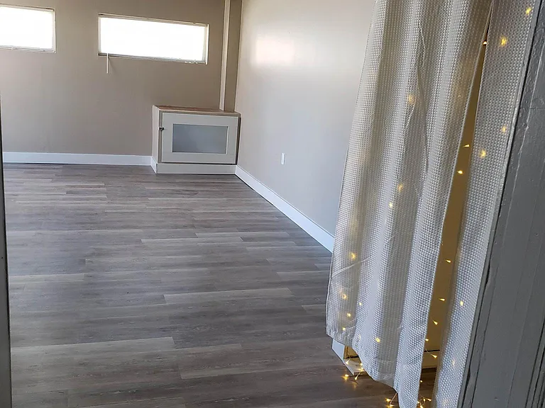 Into LIving room from kitchen doorway. UNFURNISHED VIEW