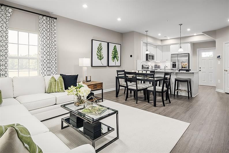 Designed for modern living, the open-concept gathering room and kitchen create the perfect space for entertaining and everyday comfort, with seamless flow, stylish finishes, and plenty of natural light.