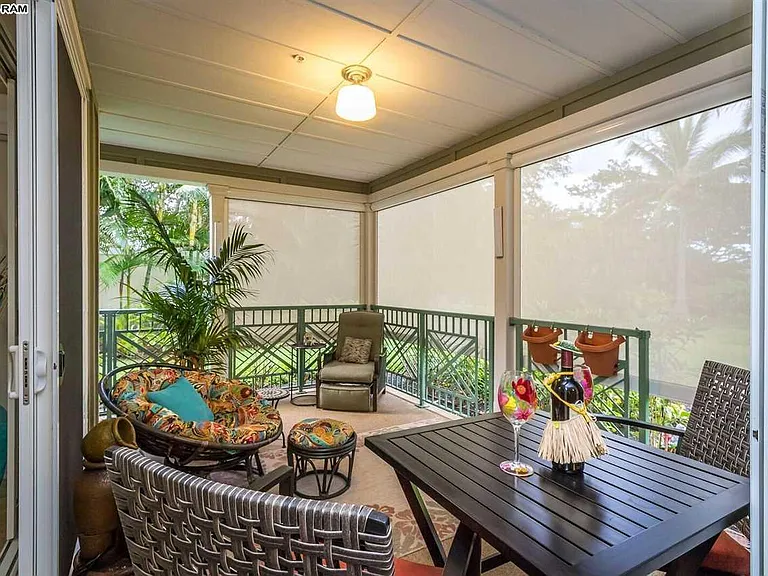 Lanai with electric shades in lower position for privacy and shade.