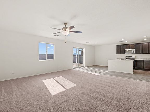 Open layout with the kitchen overlooking the family room and breakfast area.