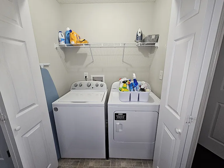 New washer and dryer. You will find an ironing board, iron, and a step stool here. Complimentary laundry and cleaning supplies are provided.