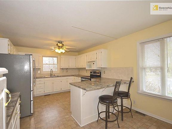 Large kitchen with breakfast bar and built-in pantry