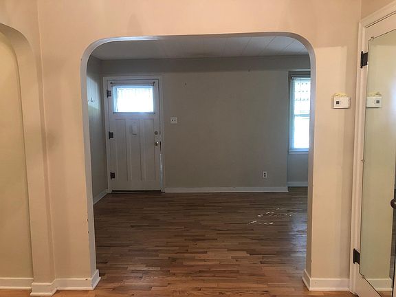 Archway connecting living room to dining room