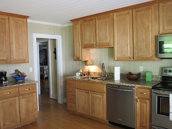 Custom cabinets in kitchen with stainless steel appliances