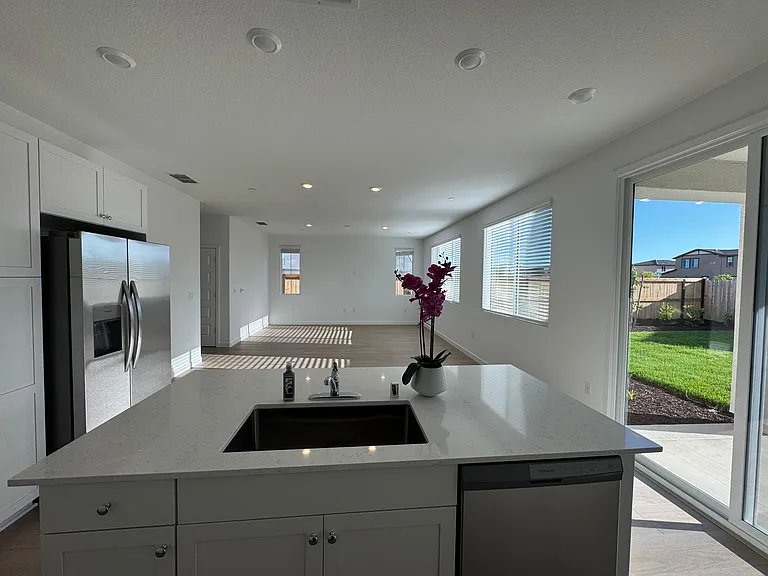 Open Kitchen with new appliances, huge island and plenty of cabinets