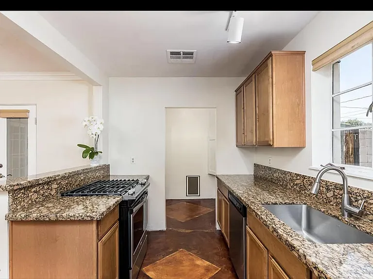 kitchen. laundry room with washer and dryer included (not pictured) toward the back