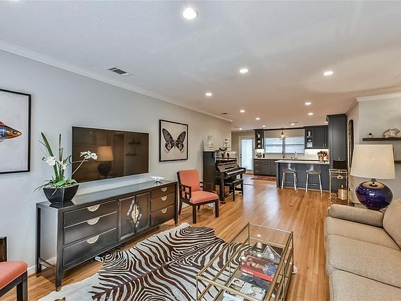 Quarter sawn oak flooring carries throughout the living area to the open concept kitchen.