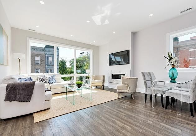 Living room with Floor to Ceiling windows and Fireplace
