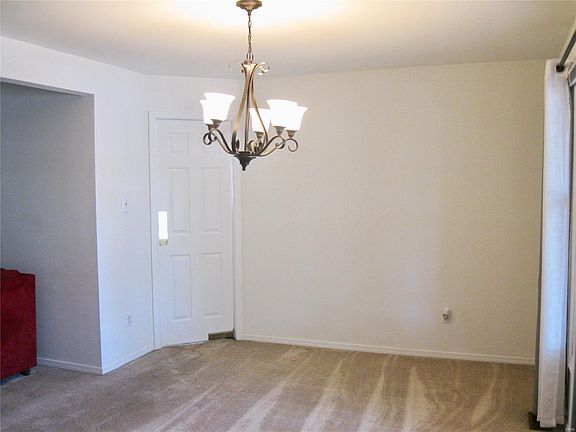 Dining area has swinging door to the kitchen for easy entertaining.