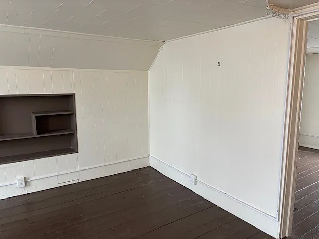 Front upstairs bedroom with door to back bedroom