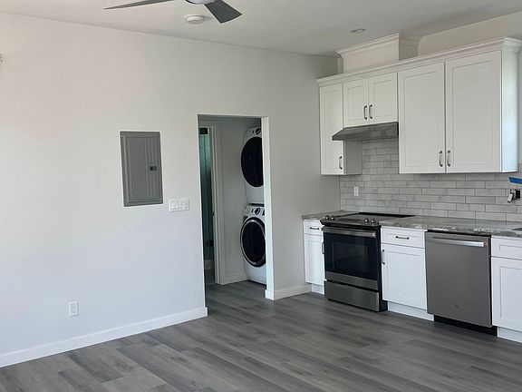 Washer dryer separate from kitchen and living room