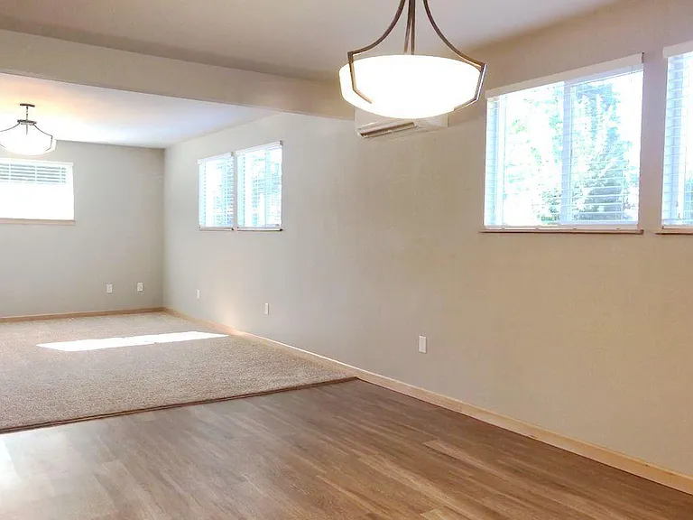 A big 1 bedroom apartment! Here's the dining area. It's perfect for a pub table or something bigger. There's even space for a buffet under the window.