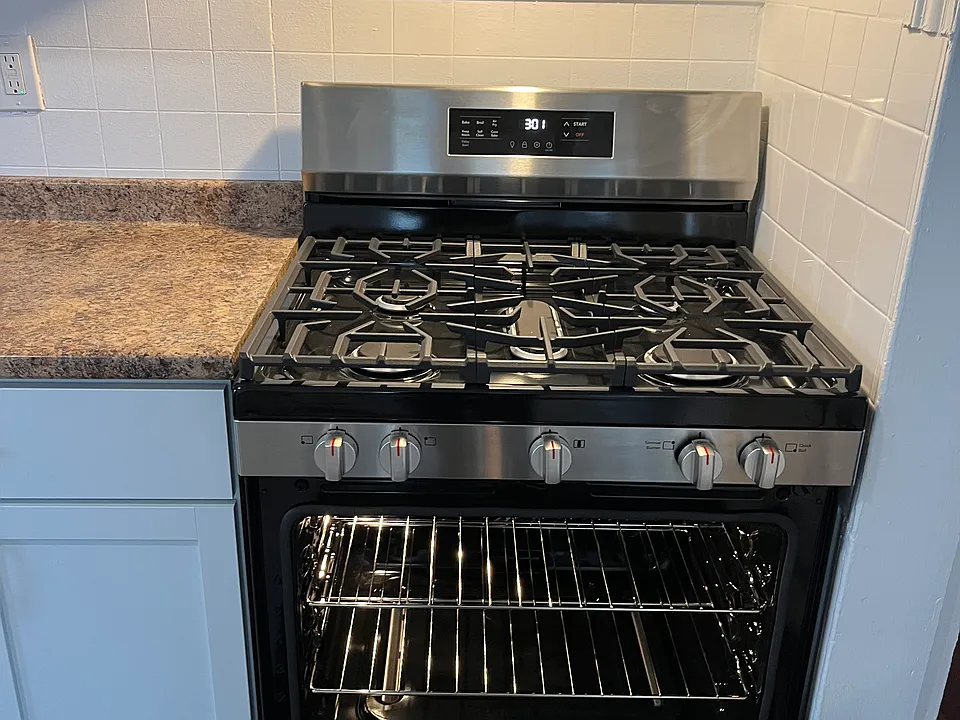 New SS self-cleaning gas stove.