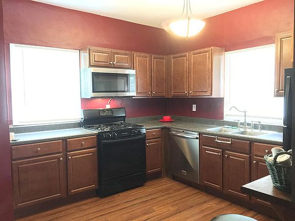 Kitchen with microwave and over range microwave