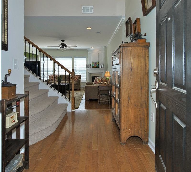 A 2-story foyer and beautiful floors greet you.