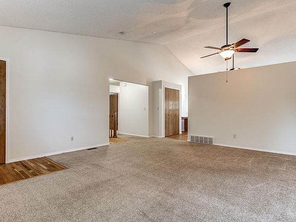 Living room looking back towards the kitchen, new paint