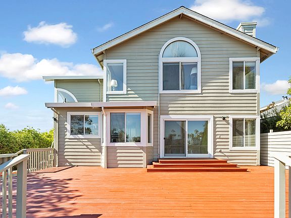 The back of the home that faces the water