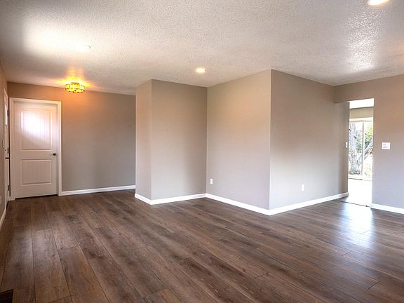 View from large living area to dining and entry,