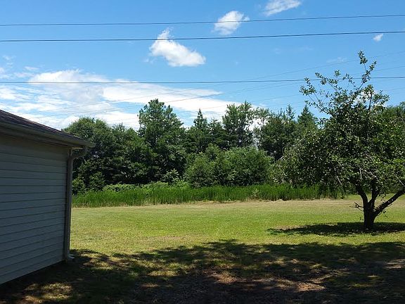 Side of Garage and Back Yard