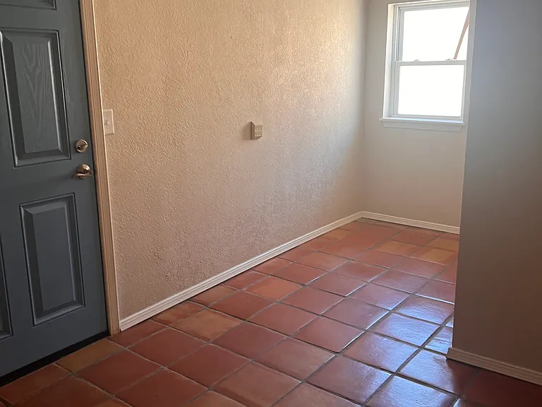 Area for an office with door leading to backyard