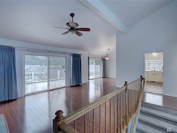 Different angle with large deck , double sliders and kitchen in background