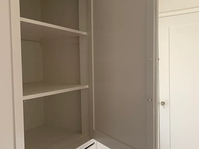 built in hallway cabinets and drawers, lots of storage typical of these vintage apartments