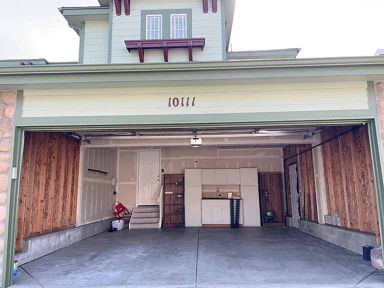 Two car garage with closed cabinets