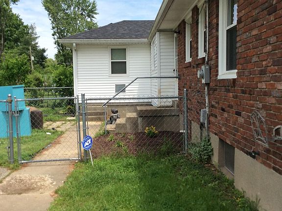 Fenced backyard with patio