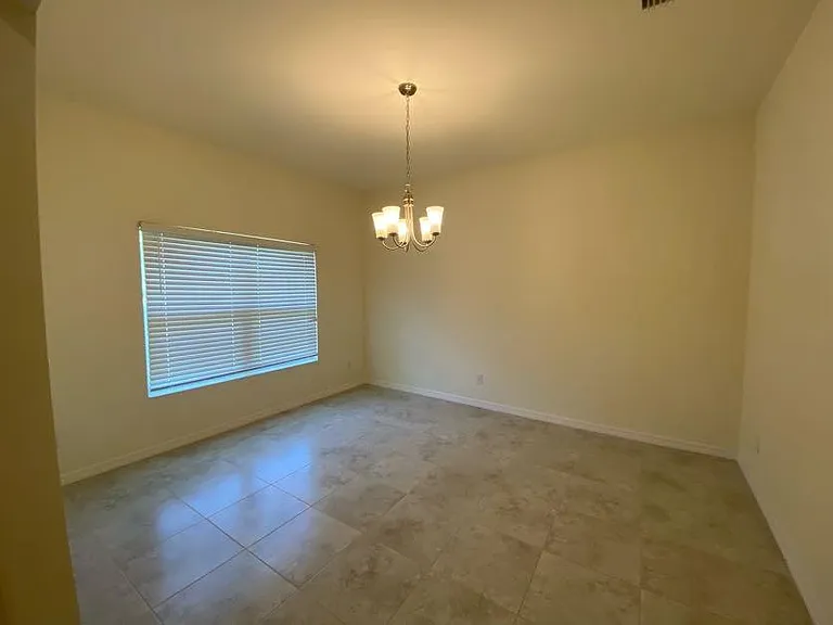 Bonus room. Could be used as a formal dining room or den.