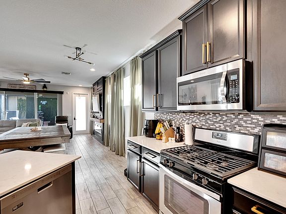 Modern applicances, gas range. lots of storage space.